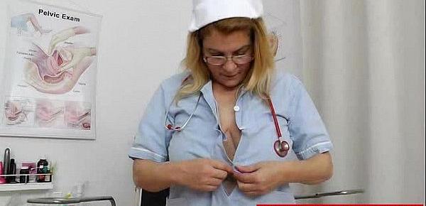  Blonde ripe nurse using the medical-instrument